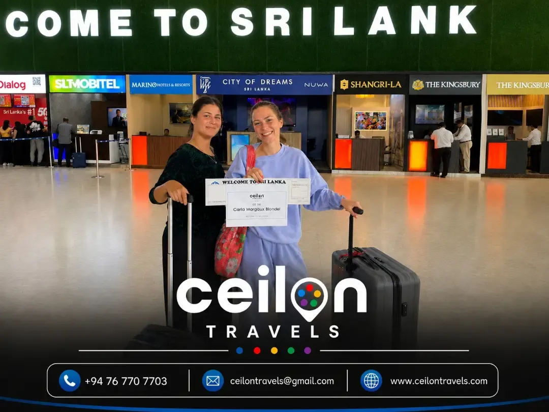 Two travellers met at Colombo airport arrivals with a CeilonTravels welcome board