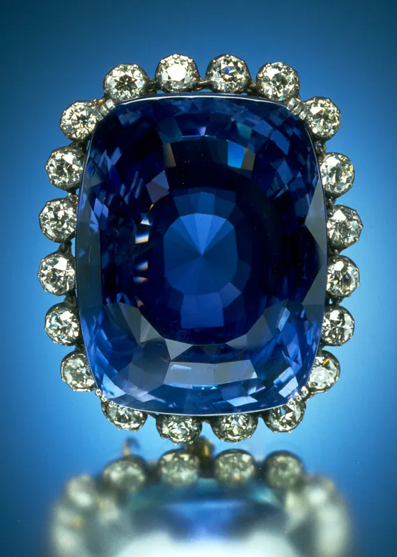 A large deep-blue faceted sapphire, the Logan Sapphire, in a diamond setting