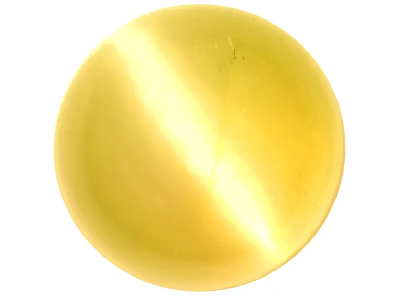 A honey-coloured cat's eye chrysoberyl cabochon with a sharp band of light across it